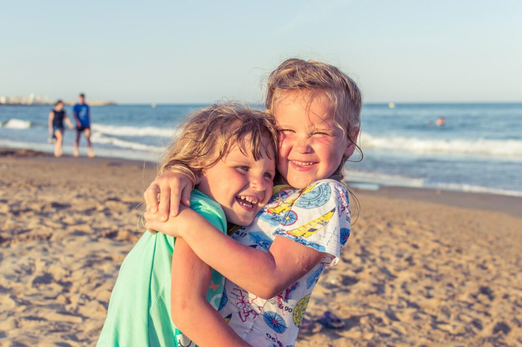 two kids on the beach